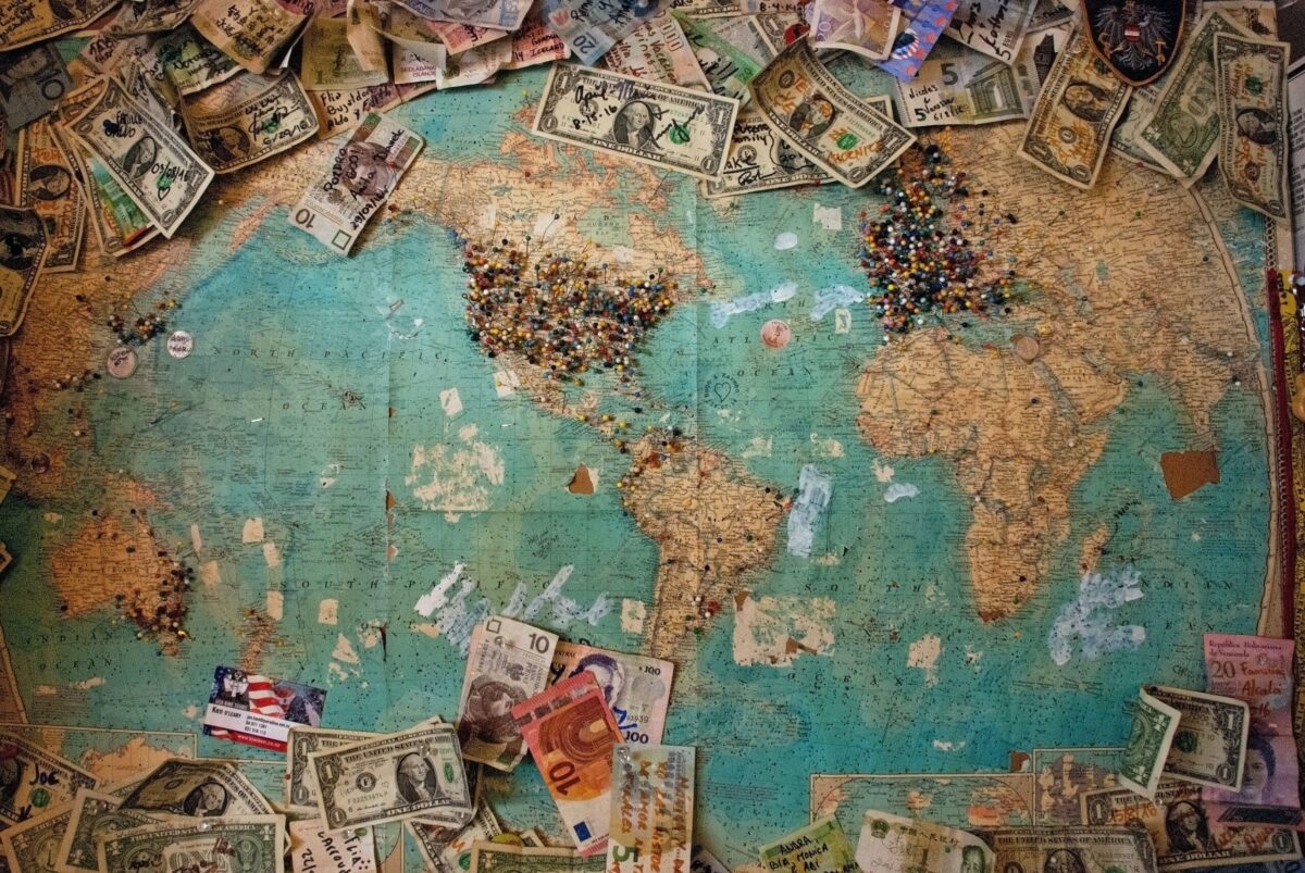 a map of the world and money around it