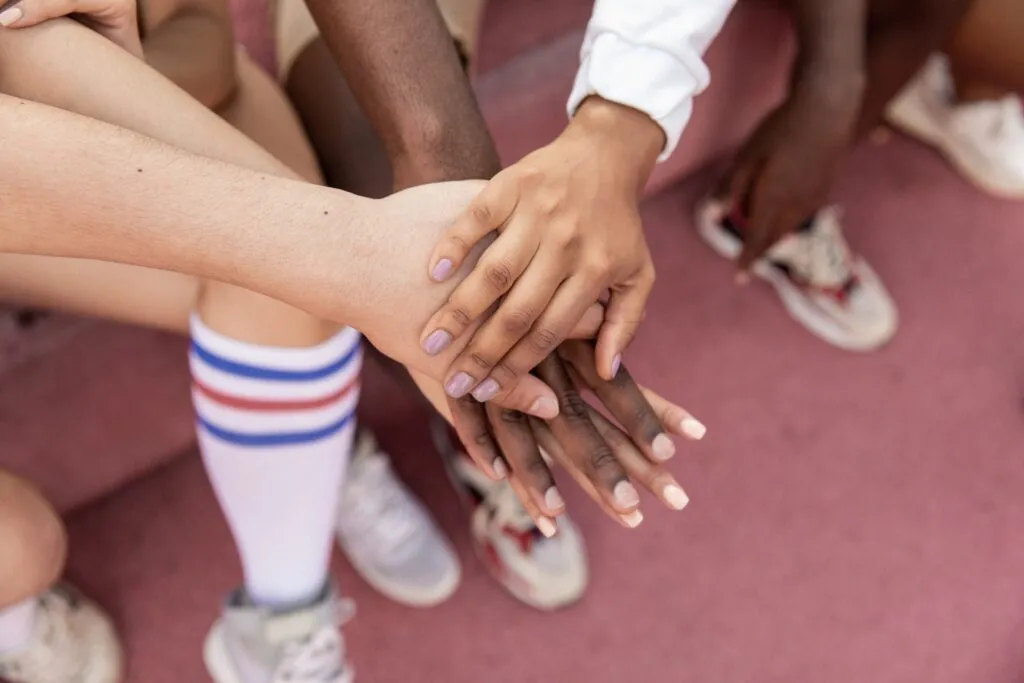 People putting their hands together