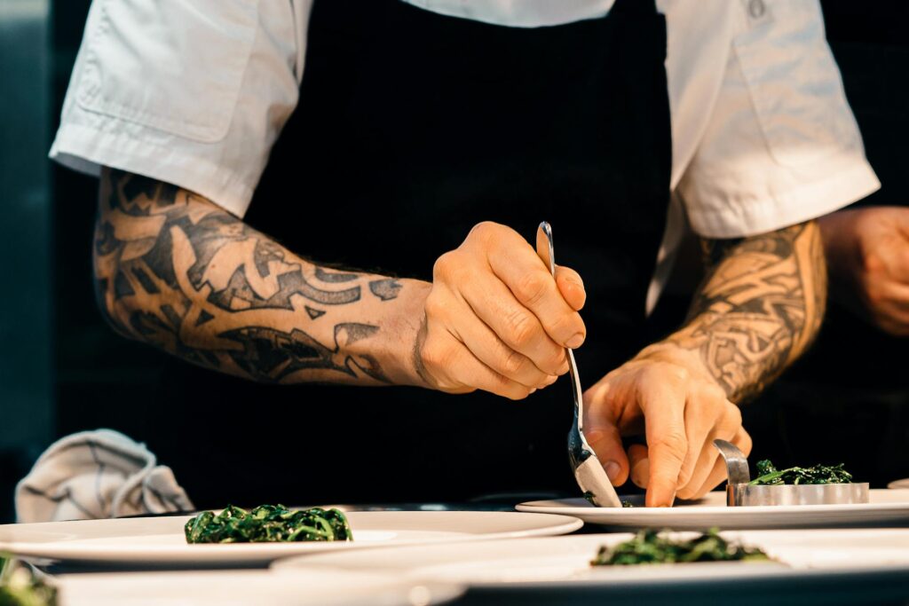 A chef finalizing the plate.