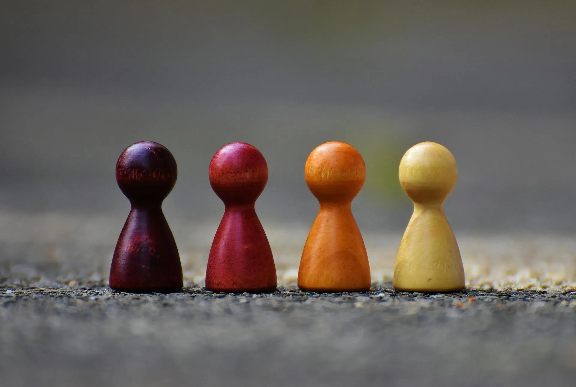 Focus photo of four wooden pawns