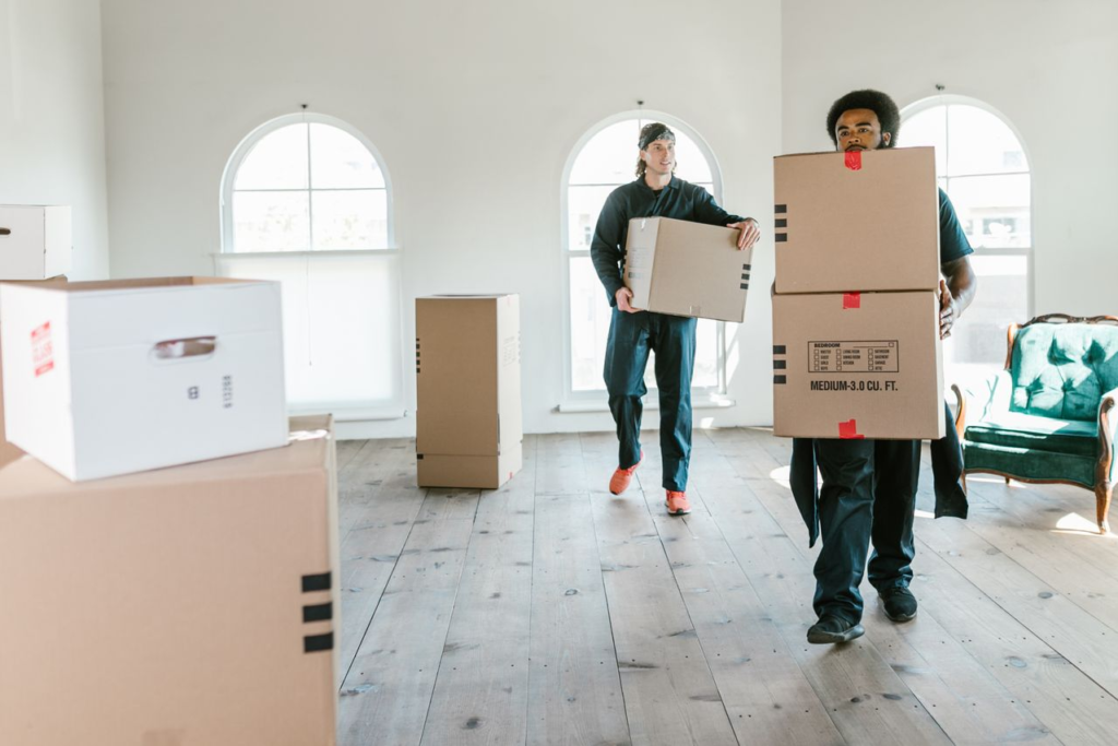A family arriving at a new home with suitcases