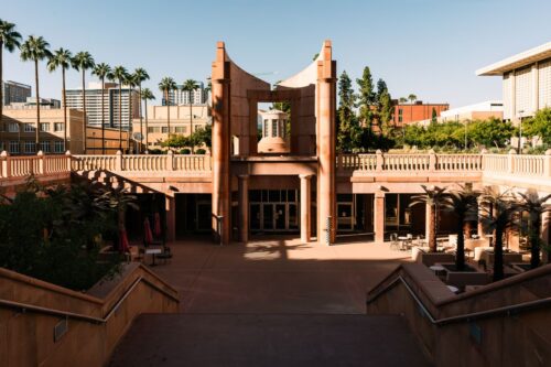 a view of modern urban architecture with palm trees in Tempe, Arizona